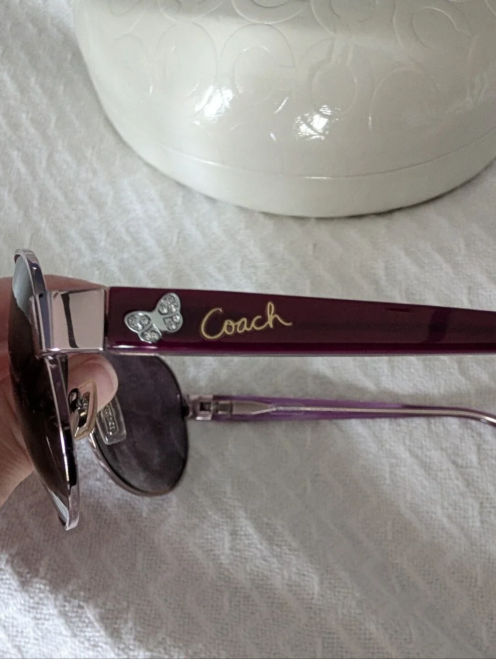 Coach Women's purple aviator sunglasses with butterfly detail